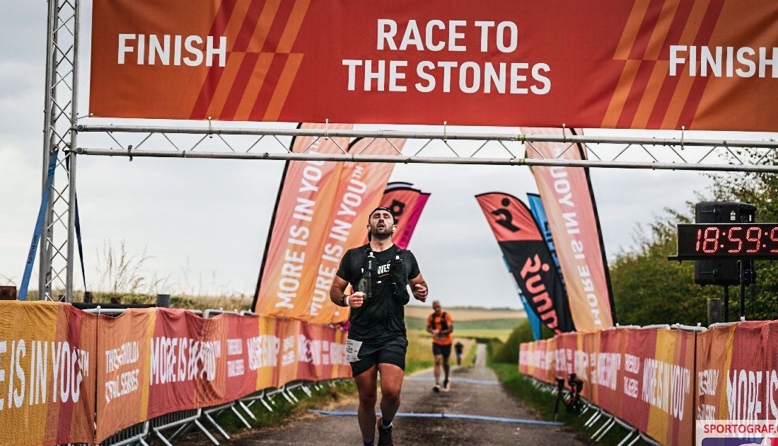 Daniel Sibal crossing the finish line at Race to the Stones